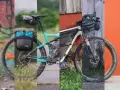 Dwa rowery górskie gotowe do bikepackingu, jeden z sakwami z tyłu, drugi z torbą na ramie.