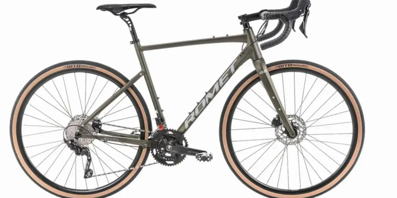 Zielony rower gravel z szerokimi oponami, idealny na każdą nawierzchnię. To jest właśnie gravel!